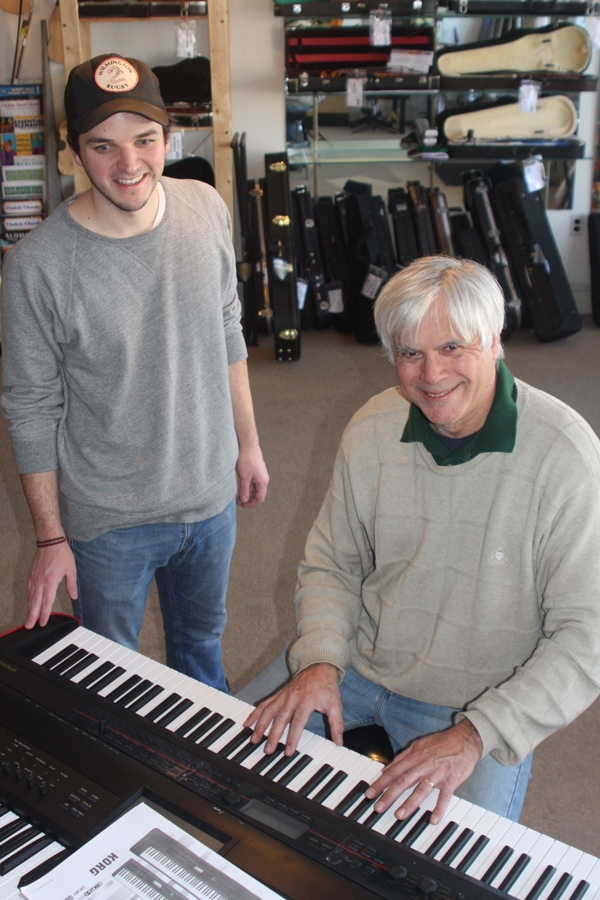 Need a little music in your life? I don't mean listening—I mean learning to play! Bill Drazga can petty much teach you how to play any musical instrument you want, and you have to go down their to look at the amazing keyboard suystem he as in. Shown here, Technician , Tim Meren and Bill Drazga, trying out the new keyboard. Music Life and Eastern shore School of Music is at 241 High St.