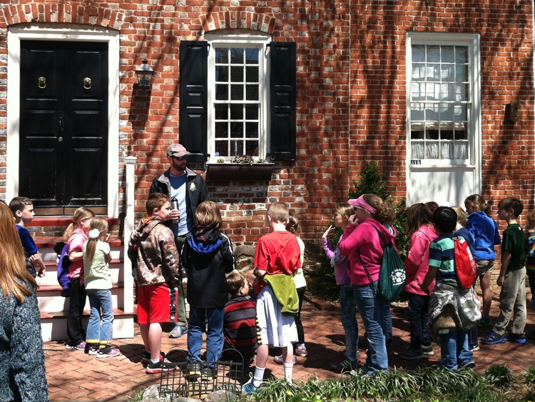 John Mann, an instructor with Sultana Education Foundation, describes colonial architecture with 3rd grade  students from Kennard Elementary School in Centreville.
