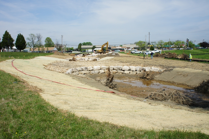 The three open channel aquatic pools will filter stormwater runoff. Tree stumps were added to anchor other aquatic plants and help sustain a new ecosystem.