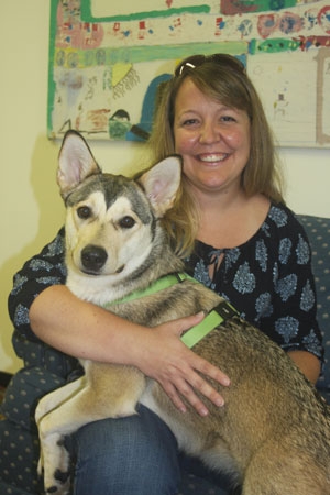 Carolyn Thompson, Director of Community Engagement at HSKC, with one of the reader dogs, Spirit.