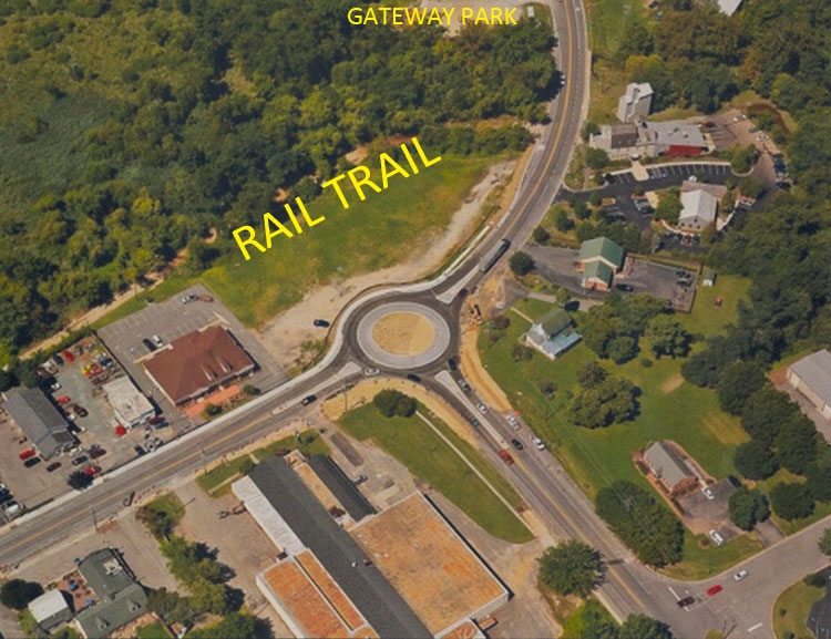 New roundabout intersecting High Street/Rt. 20 and Morgnec Rd./Rt. 291. Aerial photograph by Tyler Campbell shows Rail Trail and site for the new park.