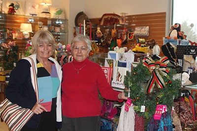 Micki Smith (R) shows off the newly opened gift shop to visitor Margurette Clark.