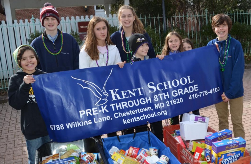  Students representing Kent School with food collected for the Backpack Program. Pictured from left to right: Reed Ferguosn, Will Cammerzell, Grayson McKenzie, Sarah Bowyer, Flynn Bowman, Isabelle Leech, Allie Butler, and Cole Ferguson.