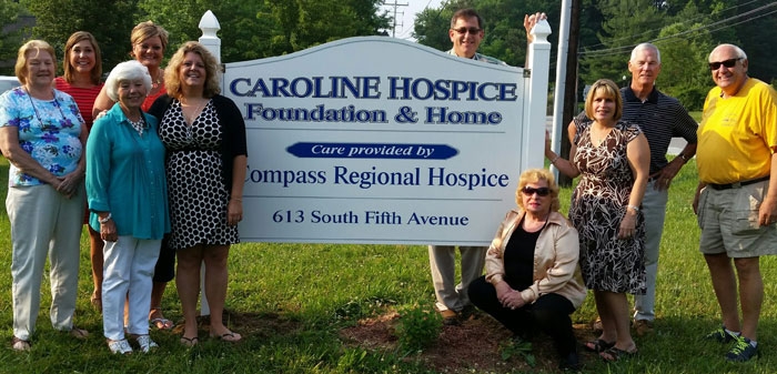 The sign in front of the Caroline Hospice Foundation (CHF) in Denton signals that expanded hospice services are coming to the county soon. The three-bed residential hospice center, which will be operated by Compass Regional Hospice, is scheduled to open in the fall of 2015. Pictured are (left to right) Sandy Keating, Heather Guerieri, executive director, Compass Regional Hospice; Elaine Nichols, CHF board member; Margie Calvello, CHF Advisory Committee; Heidi Plutschak, Director, CHF; Dave Whaley, CHF board member; Betty Balles, CHF board president; Laura Harris, CHF board vice president; and Al Turner and Richard Harfield CHF board members.