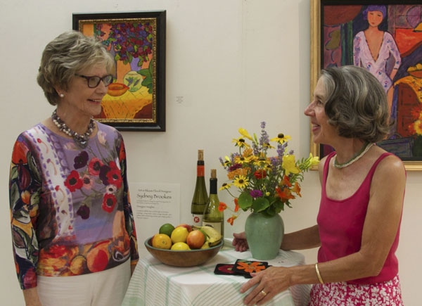 Kathy Lazo (who painted the artwork on the wall, and Sydney Brookes, who created a floral inspiration inspired by Kathy’s pieces for Art in Bloom. 