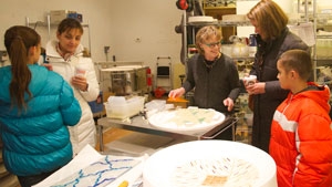Patti Hegland enjoys talking with visitors and demonstrating her glass process