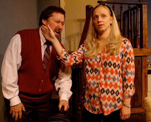 Suzy (Becca Van Aken) playfully slaps her husband Sam (Brian Whitaker); an endearing game they share