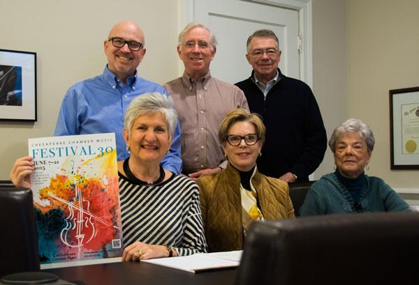 Pictured is Chesapeake Chamber Music Festival Committee showcasing this year’s Festival 30 poster, created by graphic designer Joanne Shipley.  The 30th Annual Chesapeake Chamber Music (CCM) Festival will be held in Easton, MD from June 7 through June 21, 2015. Pictured front row, left to right are Festival chairperson Bernice Michael and committee members Carolyn Rugg, Mary Riedlin. Pictured back row are Don Buxton, director of CCM; Mike Bracy, president of CCM, and Bill Geoghegan, Director of Communications.