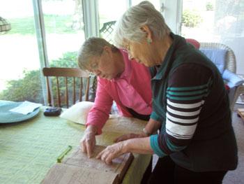 Kate Fones and Betty Seymour viewing records from the family bible of Aaron Anthony, owner and possibly the father of Frederick Douglass. The bible is on loan from the Oxford Museum. Photos of its' family records are on view as part of the new Frederick Douglass exhibit for 2015.