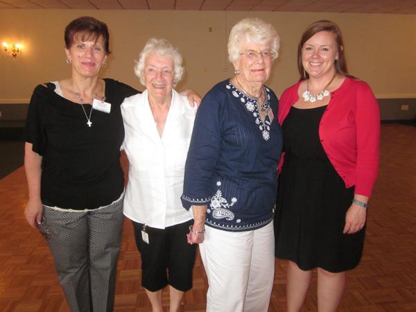 Nina Huguenin (far left), Estate Treasures volunteer coordinator, and Courtney Williams (far right), Compass Regional Hospice manager of volunteer and professional services, honor Betty Stewart (center-left) and Lucille Thomas (center-right) for 15 years of volunteer service.