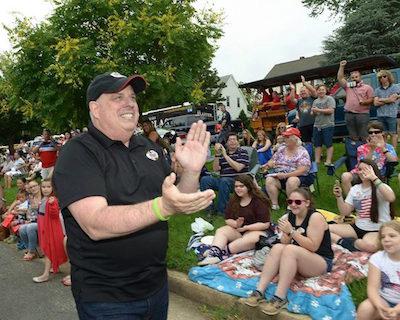 Gov. Larry Hogan plans on staying close to home this month where he gets warmly greeted, as he did on Monday at the Arbutus parade. Photo by Governor's Office.